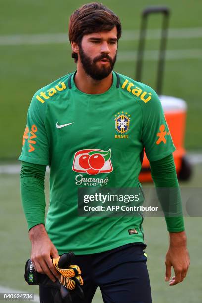 Brazil's team goalkeeper Alisson takes part in a training session at the Beira Rio stadium in Porto Alegre, Brazil on August 29, 2017 ahead of their...