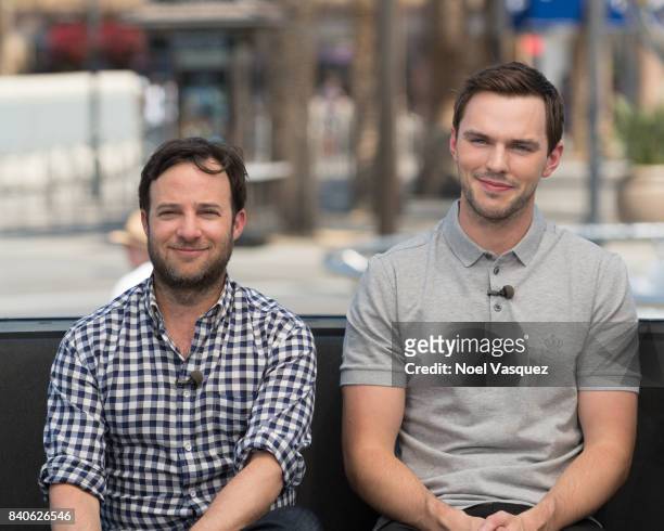 Danny Strong and Nicolas Hoult visit "Extra" at Universal Studios Hollywood on August 29, 2017 in Universal City, California.