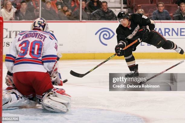 Henrik Lundqvist of the New York Rangers defends in the net against a shot from Teemu Selanne of the Anaheim Ducks during the game on December 16,...