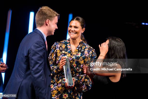 Crown Princess Victoria of Sweden awards the Stockholm Junior Water Prize to Ryan Thorpe and Rachel Chang of the United States during a ceremony for...