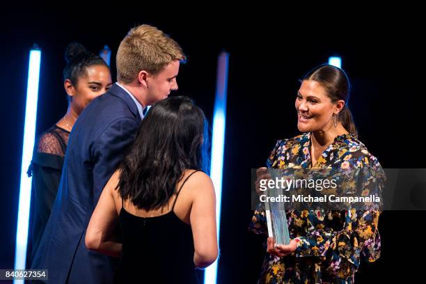 Crown Princess Victoria of Sweden awards the Stockholm Junior Water Prize to Ryan Thorpe and Rachel Chang of the United States during a ceremony for...