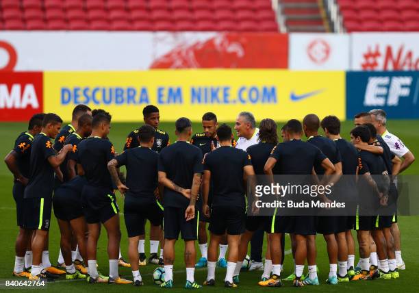 Head coach Tite speaks with brazilian players during a training session at the Beira Rio Stadium on August 29, 2017 in Porto Alegre, Brazil, ahead of...