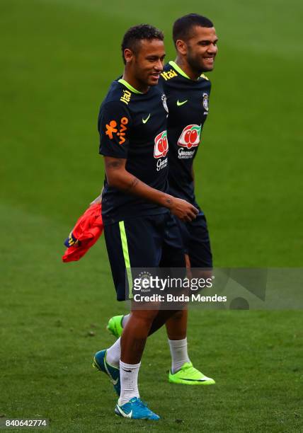 Neymar and Daniel Alves take part in a training session at the Beira Rio Stadium on August 29, 2017 in Porto Alegre, Brazil, ahead of their 2018 FIFA...