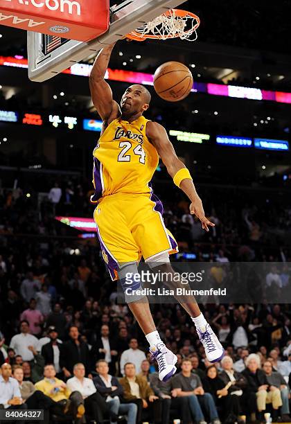 Kobe Bryant of the Los Angeles Lakers slam dunks during the game against the New York Knicks at Staples Center on December 16, 2008 in Los Angeles,...