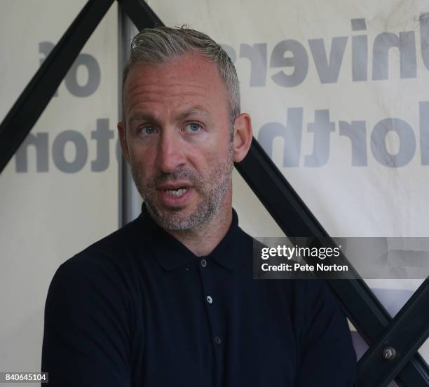 Cambridge United manager Shaun Derry looks on prior to the Checkatrade Trophy match between Northampton Town and Cambridge United at Sixfields on...