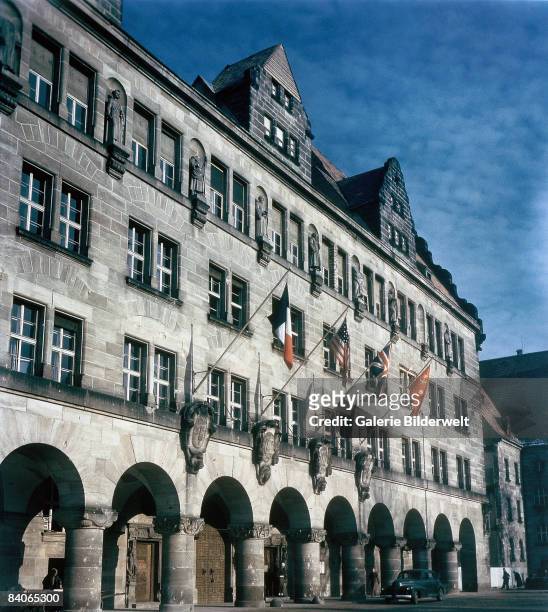 Allied flags outside the Palace of Justice, in Nuremberg, during proceedings against leading Nazi figures for war crimes at the International...