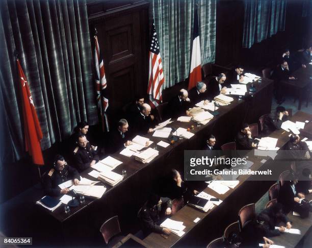 The judges at their bench in Room 600 at the Palace of Justice, Nuremberg, during proceedings against leading Nazi figures for war crimes at the...