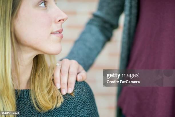 helping hand from a friend - grief hands stock pictures, royalty-free photos & images