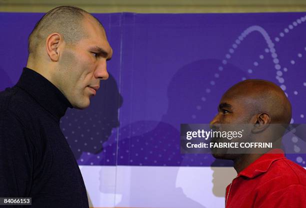 World Boxing Association heavyweight champion Russian Nikolai Valuev faces US challenger Evander Holyfield during a press conference on December 17,...