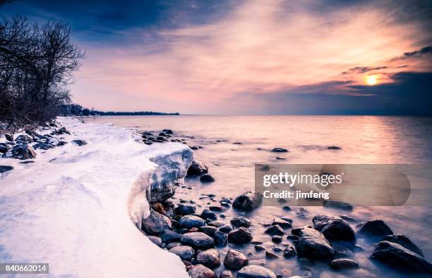 shore lake - beach winter stock pictures, royalty-free photos & images