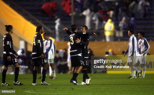 Patricio Urrutia and Renan Calle of Liga de Quito celebrate after defeating Pachuca at the FIFA Club World Cup Japan 2008 semi final match between...