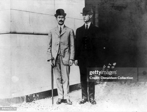 Airplane pioneers Wilbur Wright and Orville Wright pose for a portrait in circa 1910.