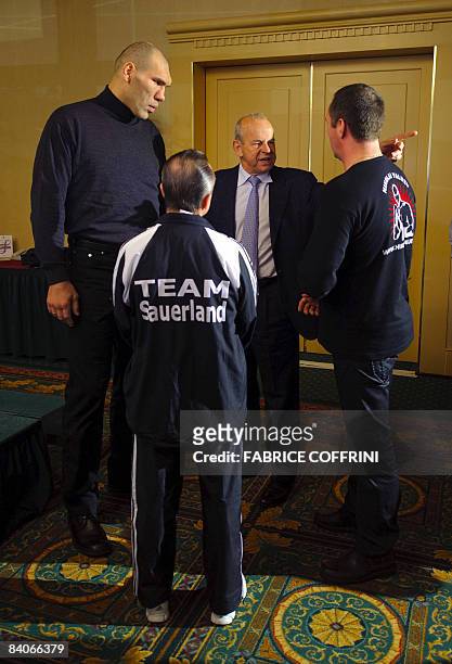 World Boxing Association heavyweight champion Russian Nikolai Valuev stands with German manager Wilfried Sauerland before a press conference on...