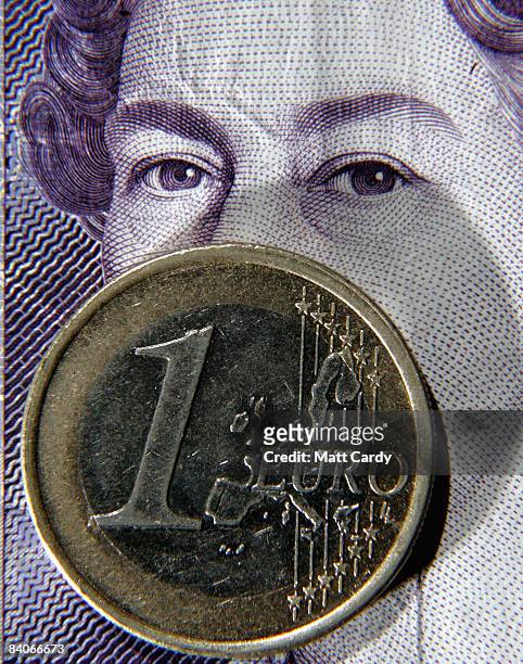 In this photo illustration a Euro coin lies on a 20 GBP note on December 17, 2008 in Bristol, England. The British Pound is currently at its lowest...