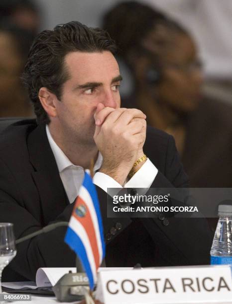 Costa Rica's Foreing Minister Bruno Stagno listens a speech during the second day of the South America and Caribbean Summit in Costa do Sauipe,...