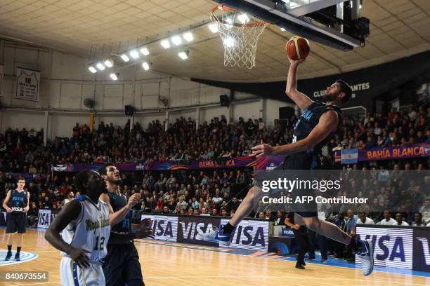 Argentina's small forward Patricio Garino shoots against Virgin Islands during their 2017 FIBA Americas Championship Group B game in Bahia Blanca,...