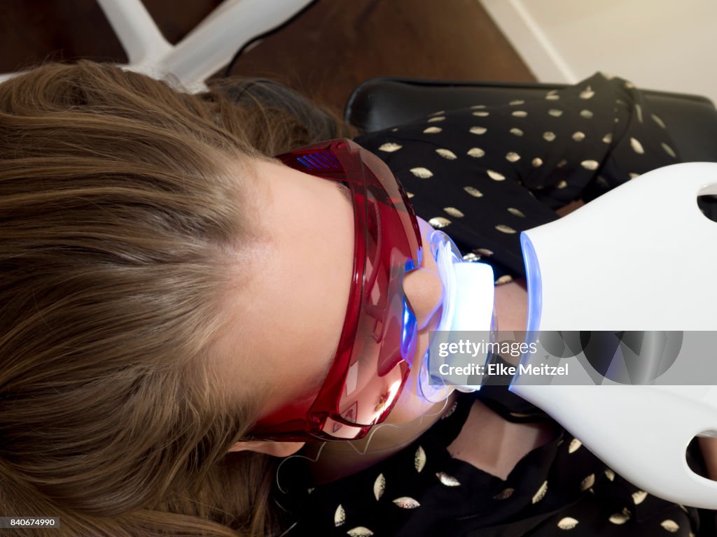 Dental patient undergoing teeth whitening