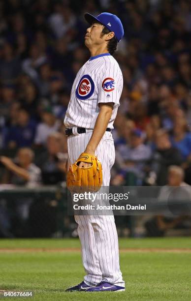 Koji Uehara of the Chicago Cubs reacts after giving up a solo home run in the 7th inning to John Jaso of the Pittsburgh Pirates at Wrigley Field on...