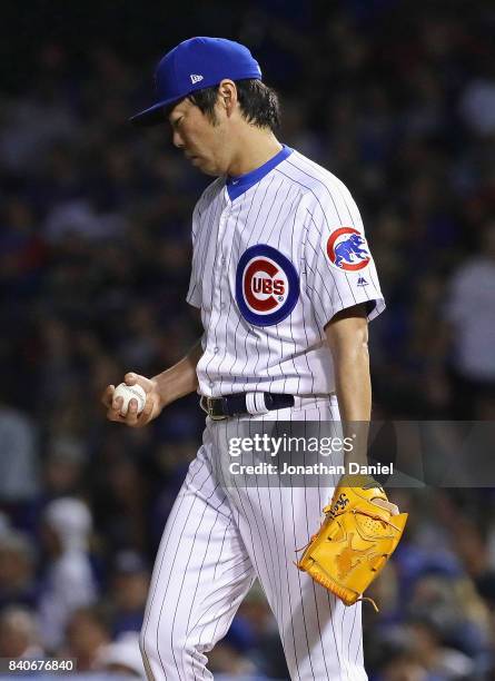 Koji Uehara of the Chicago Cubs reacts after giving up a single in the 7th inning against the Pittsburgh Pirates at Wrigley Field on August 29, 2017...