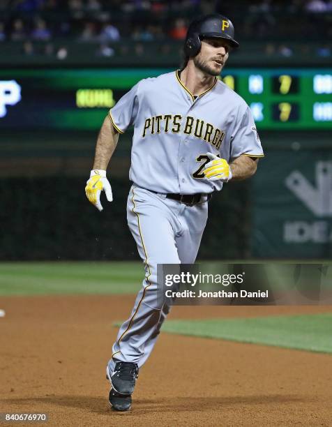 John Jaso of the Pittsburgh Pirates runs the bases after hitting a solo home run in the 7th inning against the Chicago Cubs at Wrigley Field on...