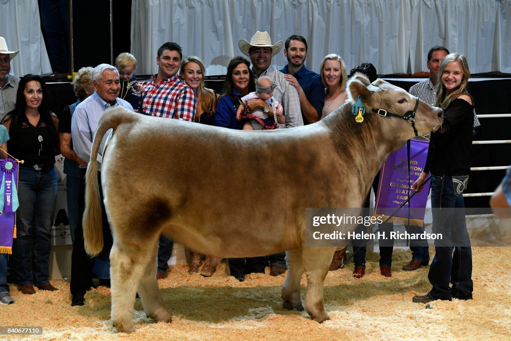 Denver Rustlers PUEBLO, CO - AUGUST- Julia Frye, of Johnston, far right, stands with ...