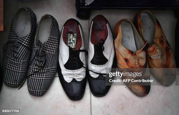 View of Pachuco-style shoes in the house of a Pachuco in Tepito neighborhood in Mexico City on August 22, 2017. Wearing their feathered hats,...