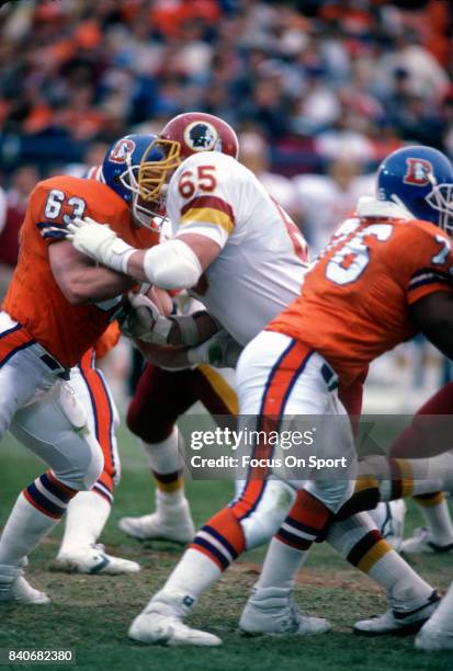 Dave Butz of the Washington Redskins in action against Mark Cooper of the Denver Broncos during an NFL football game December 13, 1986 at Mile High...