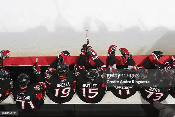 Nick Foligno, Dany Heatley, Daniel Alfredsson, Jason Spezza and Jarkko Ruutu of the Ottawa Senators sit on the bench during their NHL game against...
