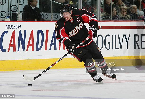 Daniel Alfredsson of the Ottawa Senators stickhandles the puck against the Florida Panthers at Scotiabank Place on December 8, 2008 in Ottawa,...
