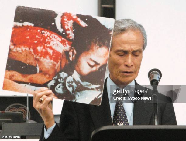 File photo taken in May 2010 shows A-bomb survivor Sumiteru Taniguchi giving a speech at the U.N. Conference on reviewing the Nuclear...