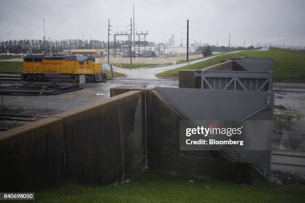 Union Pacific Corp. Locomotive sits in floodwaters from Hurricane Harvey in Texas City, Texas, U.S., on Tuesday, Aug. 29, 2017. Estimates for damages...