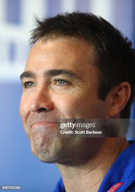 Brad Scott, coach of the Kangaroos smiles as he speaks to the media during a North Melbourne Kangaroos AFL press conference at the Arden Street...