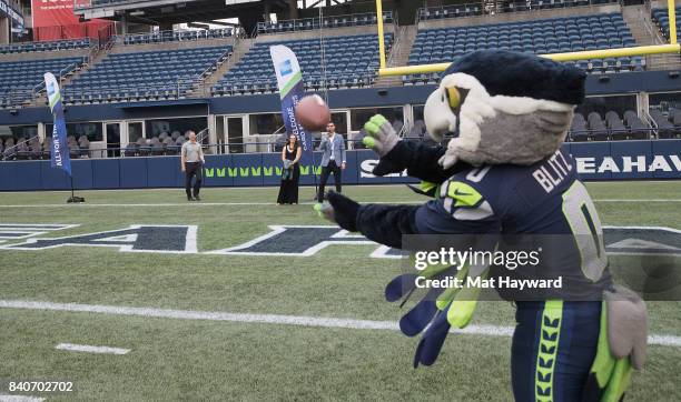 Seattle Seahawks mascot Blitz catches a football pass during American Express "Dinner on the 50" at CenturyLink Field on August 29, 2017 in Seattle,...