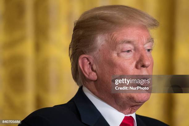 President Donald Trump speaks during his joint press conference with President Sauli Niinistö of the Republic of Finland, in the East Room of the...