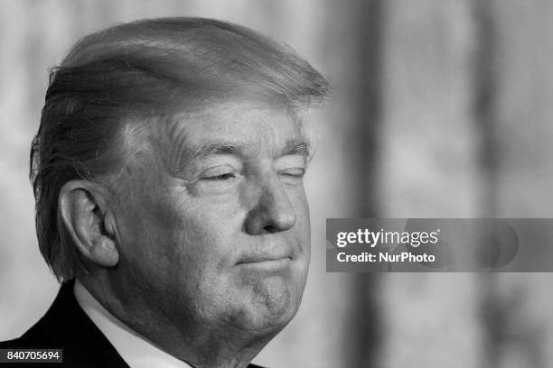 President Donald Trump listens, during his joint press conference with President Sauli Niinistö of the Republic of Finland, in the East Room of the...