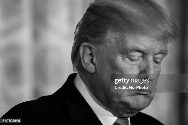 President Donald Trump listens, during his joint press conference with President Sauli Niinistö of the Republic of Finland, in the East Room of the...