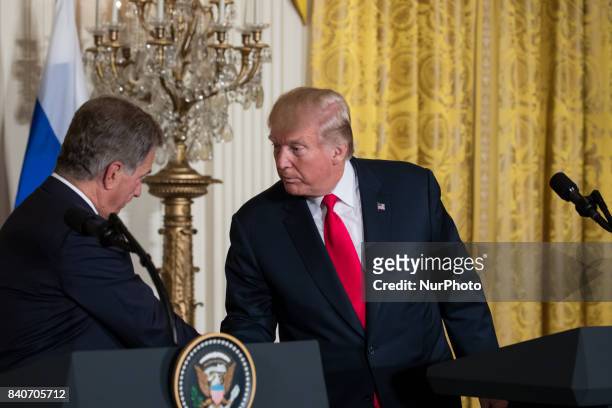 President Sauli Niinistö of the Republic of Finland, and U.S. President Donald Trump, shake hands during their joint press conference in the East...