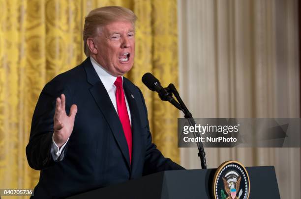 President Donald Trump speaks during his joint press conference with President Sauli Niinistö of the Republic of Finland, in the East Room of the...