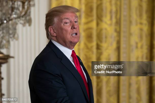 President Donald Trump leaves his joint press conference with President Sauli Niinistö of the Republic of Finland, in the East Room of the White...
