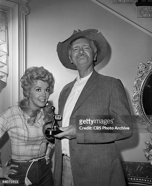 Donna Douglas as Elly May Clampett, left, and Buddy Ebsen as Jed Clampett of the television show 'The Beverly Hillbillies' holding the Australian...