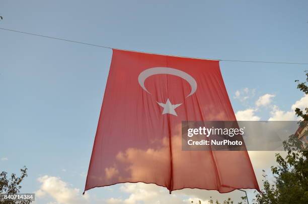 Huge Turkish flag can be seen posted between two residential buildings in Ankara, Turkey on August 29, 2017 as Turkish citizens prepare to celebrate...