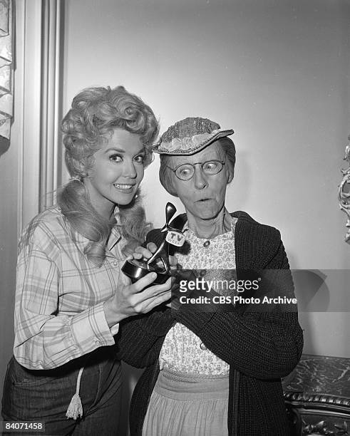 Actresses Donna Douglas as Elly May Clampett, left, and Irene Ryan as Granny Daisy Moses, hold the Australian television industry's award, the...