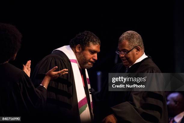 Dr. Bernard L. Richardson, Howard University, Dean of the Chapel, , reaches out to touch guest preacher, , Bishop William J. Barber, II, Pastor,...