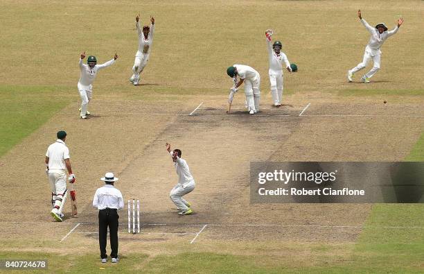 Matthew Wade of Australia is dismissed by Shakib Al Hasan of Bangladesh during day four of the First Test match between Bangladesh and Australia at...