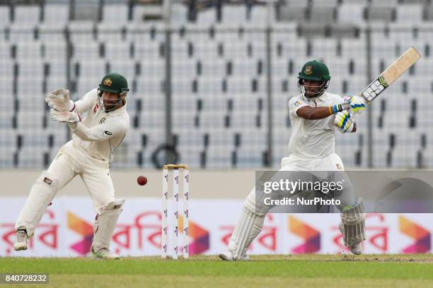 Bangladeshi cricketer Sabbir Rahman plays a shot during the third day of the first Test cricket match between Bangladesh and Australia at the...