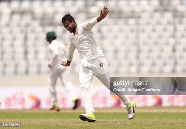 Shakib Al Hasan of Bangladesh celebrates taking the wicket of Glenn Maxwell of Australia during day four of the First Test match between Bangladesh...