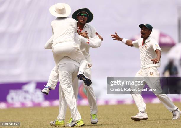 Shakib Al Hasan of Bangladesh celebrates taking the wicket of Glenn Maxwell of Australia during day four of the First Test match between Bangladesh...