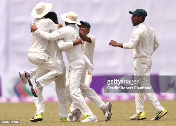 Shakib Al Hasan of Bangladesh celebrates taking the wicket of Glenn Maxwell of Australia during day four of the First Test match between Bangladesh...