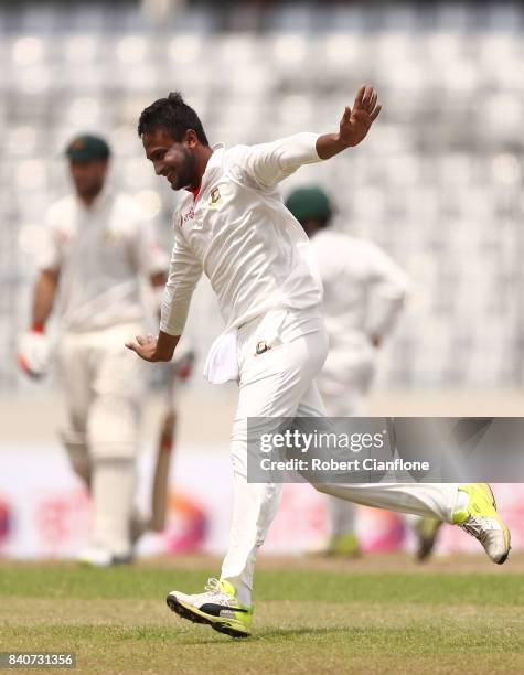 Shakib Al Hasan of Bangladesh celebrates taking the wicket of Glenn Maxwell of Australia during day four of the First Test match between Bangladesh...