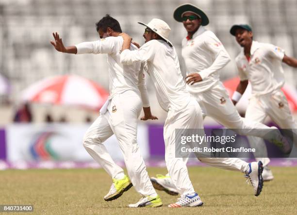 Shakib Al Hasan of Bangladesh celebrates taking the wicket of Glenn Maxwell of Australia during day four of the First Test match between Bangladesh...